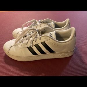 Boys adidas white shoes w black stripes.